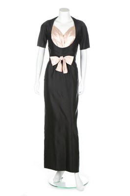 Lot 138 - A Maggy Rouff couture black satin evening gown,...