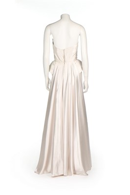 Lot 103 - A Maggy Rouff couture ice-white satin sheath,...