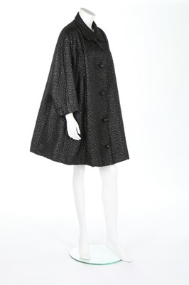 Lot 149 - A fine Balenciaga couture black ciré matelassé...