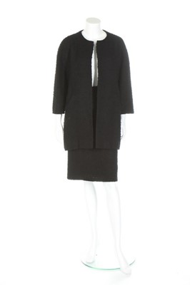 Lot 170 - A Balenciaga couture black bouclé wool suit,...