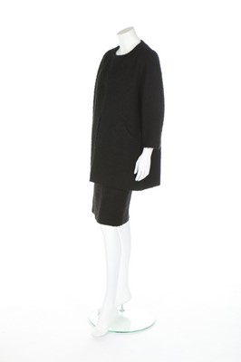 Lot 170 - A Balenciaga couture black bouclé wool suit,...