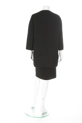 Lot 170 - A Balenciaga couture black bouclé wool suit,...