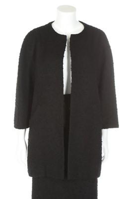 Lot 170 - A Balenciaga couture black bouclé wool suit,...