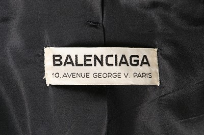 Lot 170 - A Balenciaga couture black bouclé wool suit,...