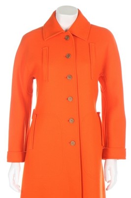 Lot 237 - An André Courrèges orange wool coat, circa...