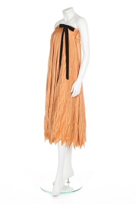 Lot 235 - A Pierre Cardin couture pleated salmon-pink...