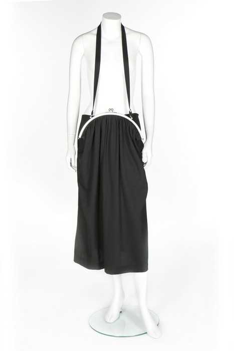 Lot 171 - A Courrèges black wool pinafore dress Lot 171 - A Courrèges black wool pinafore dress