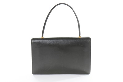 Lot 18 - An Hermès black leather handbag, 1960s,...