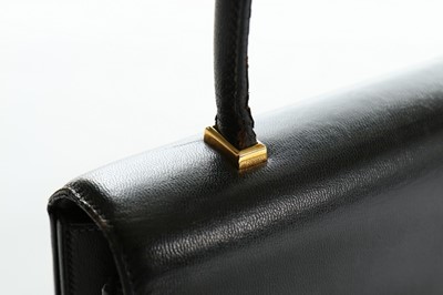 Lot 18 - An Hermès black leather handbag, 1960s,...