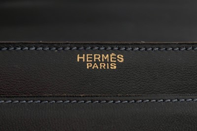 Lot 69 - An Hermès black leather handbag, 1960s,...
