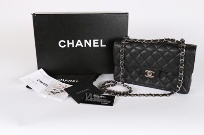 Lot 2 - A Chanel quilted black caviar leather 2.55 bag,...