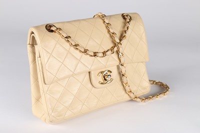 Lot 10 - A Chanel beige quilted leather 2.55 bag, 1980s,...