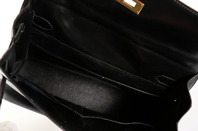 Lot 7 - An Hermès black leather Kelly bag, 1960s,...