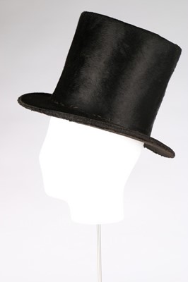 Lot 41 - A gentleman's black beaver stove pipe hat in...