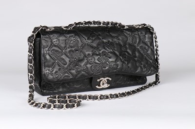 Lot 6 - A Chanel black embossed leather handbag,...