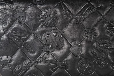 Lot 6 - A Chanel black embossed leather handbag,...