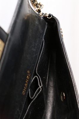 Lot 11 - A Chanel quilted black leather slim shoulder...