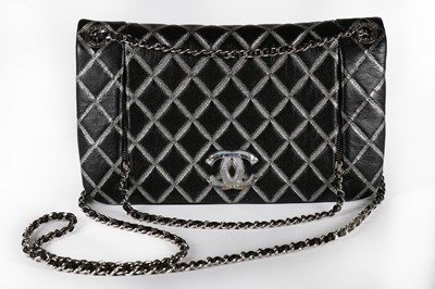 Lot 22 - A Chanel black and silver quilted leather bag,...