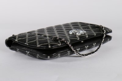 Lot 22 - A Chanel black and silver quilted leather bag,...