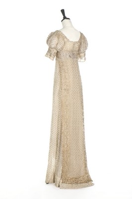 Lot 43 - A silver-strip embroidered muslin dress, circa...