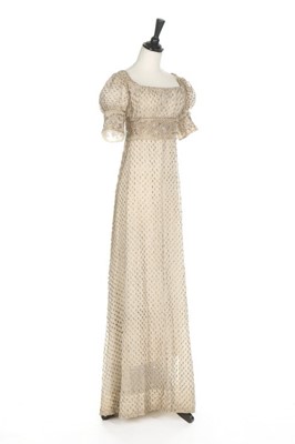 Lot 43 - A silver-strip embroidered muslin dress, circa...