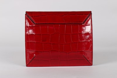 Lot 17 - An Alexander McQueen red mock-croc leather...