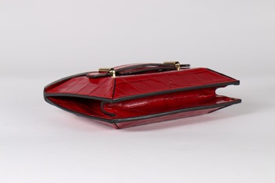 Lot 17 - An Alexander McQueen red mock-croc leather...
