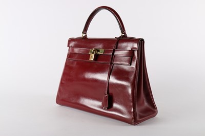 Lot 19 - An Hermès ox-blood leather Kelly bag, 1960s,...