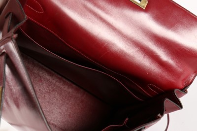 Lot 19 - An Hermès ox-blood leather Kelly bag, 1960s,...