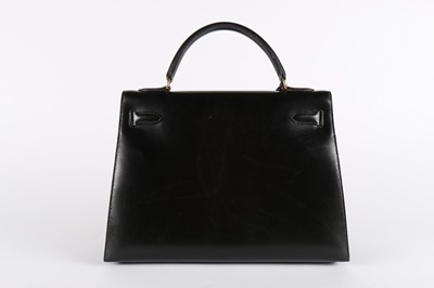 Lot 20 - A good Hermès black leather Kelly bag, 1992,...