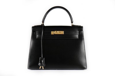 Lot 25 - An Hermès black leather Kelly bag, 1993, blind...