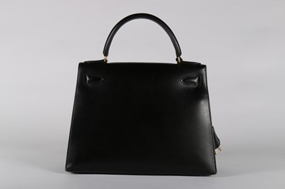 Lot 25 - An Hermès black leather Kelly bag, 1993, blind...