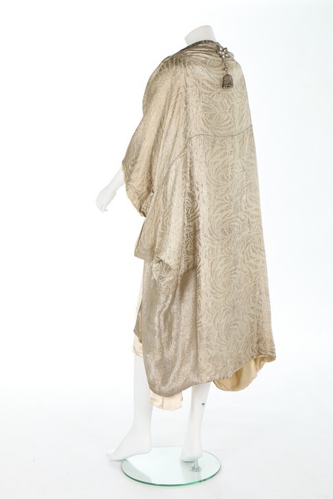 Lot 64 - A gold lamé cocoon-like opera cape, mid 1920s,