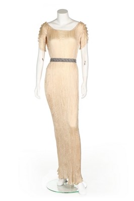 Lot 69 - A Mariano Fortuny ivory silk Delphos gown,...