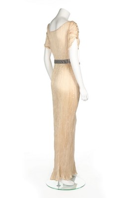 Lot 69 - A Mariano Fortuny ivory silk Delphos gown,...