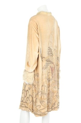 Lot 57 - A lavishly beaded ivory velvet opera coat,...