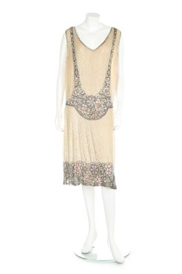 Lot 76 - A beaded ivory and pink tulle flapper dress,...