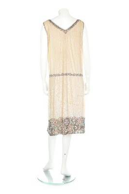 Lot 76 - A beaded ivory and pink tulle flapper dress,...
