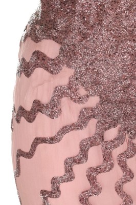 Lot 85 - An haute couture beaded bias-cut pink chiffon...