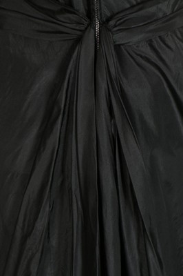 Lot 105 - An Edward Molyneux couture black taffeta...