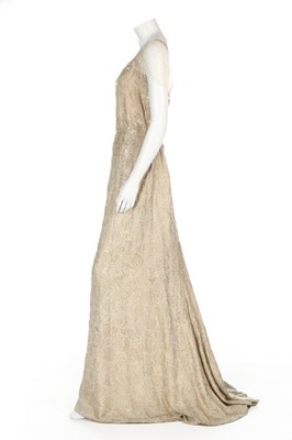 Lot 92 - A Norman Hartnell couture ivory and gold...