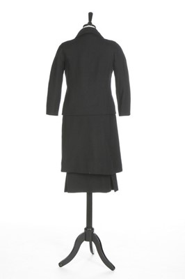 Lot 115 - A Balenciaga couture black wool suit, circa...