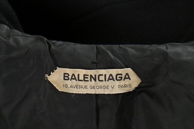Lot 115 - A Balenciaga couture black wool suit, circa...