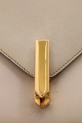 Lot 73 - An Hermès ivory leather 'New Jimmy' handbag,...