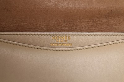 Lot 73 - An Hermès ivory leather 'New Jimmy' handbag,...