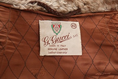Lot 75 - A Gucci brown suede cape, circa 1970, labelled...