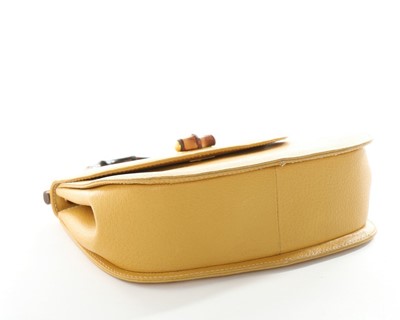Lot 85 - A Gucci leather 'bamboo' handbag, 1990s,...