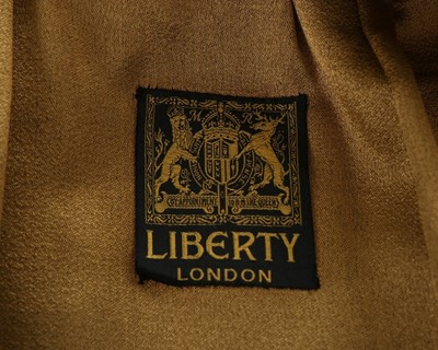 Lot 88 - A Liberty gold brocaded black satin opera cape,...