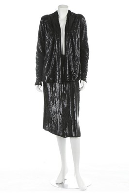 Lot 95 - A black sequined jacket and skirt, late 1930s,...