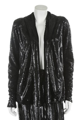 Lot 95 - A black sequined jacket and skirt, late 1930s,...